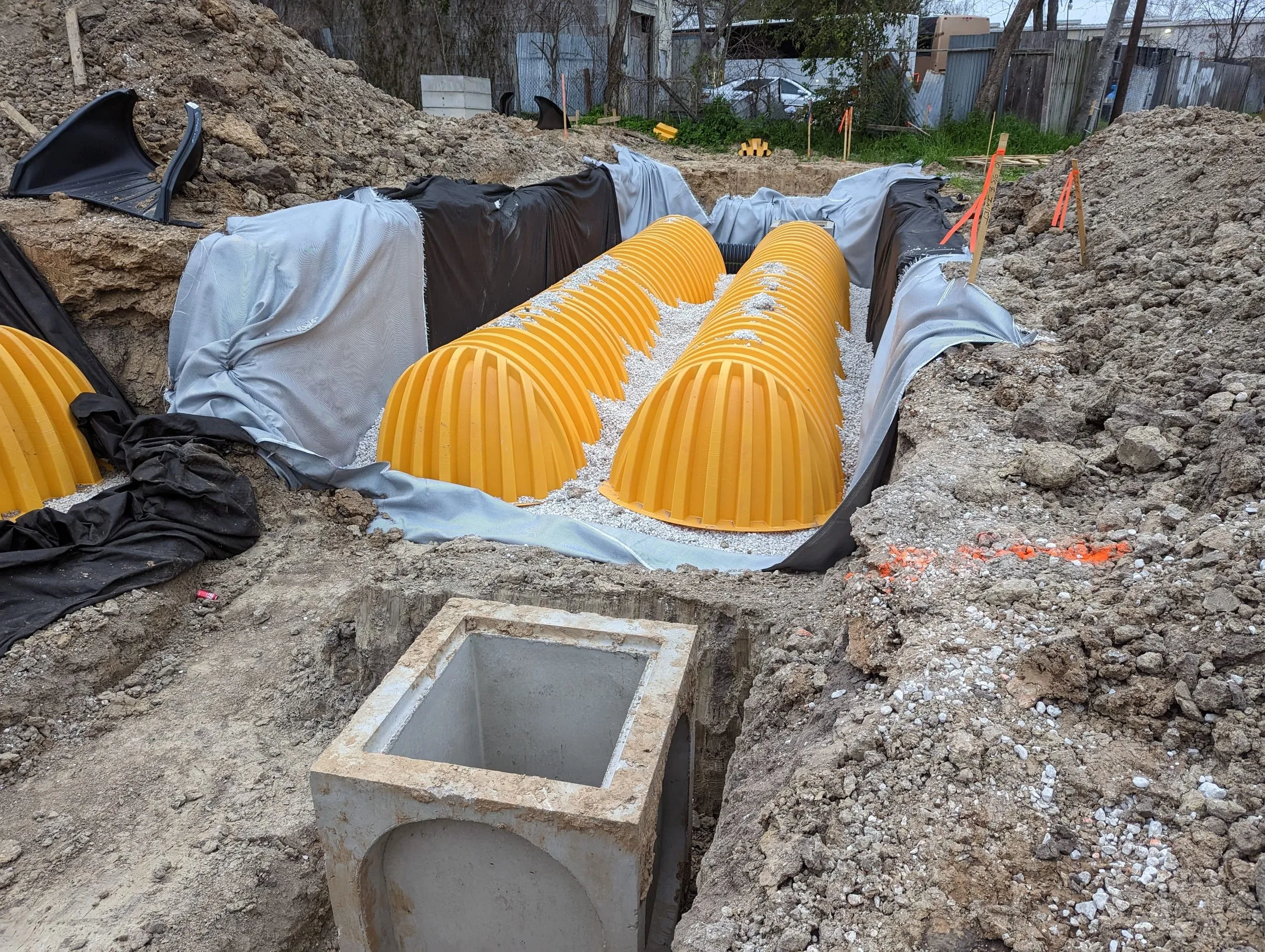 Stormwater detention chambers being installed in an excavation